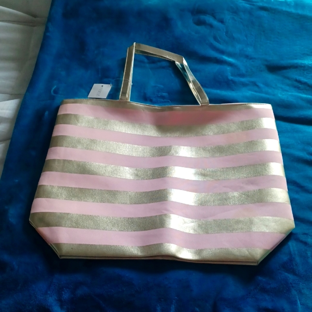 Handbag/tote for woman in pink and gold. From Macy's.  19x14. Nice for shopping